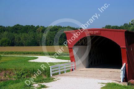 A red covered bridge in Madison County, Iowa. Hogback Bridge.
