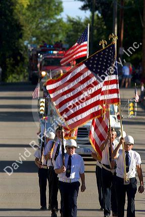 Veterans of Traer, Iowa march as honor guard in a parade for the Festival of the Spiral Steps.