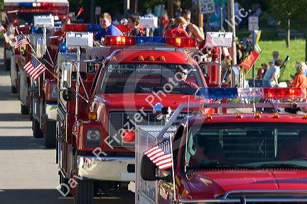 Firemen of Traer, Iowa parade their trucks in the Festival of the Spiral Steps.
