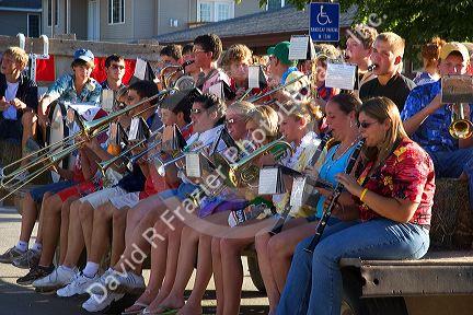 High School  band rides farm wagon during the parade for the festival of the spiral steps at Traer, Iowa.