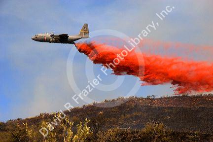 An airplane drops fire retardant on a fire in the Boise foothills, Idaho.
