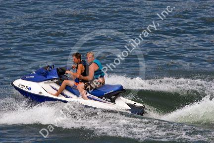 Recreationists ride a jet ski on Lucky Peak Reservior near Boise, Idaho.