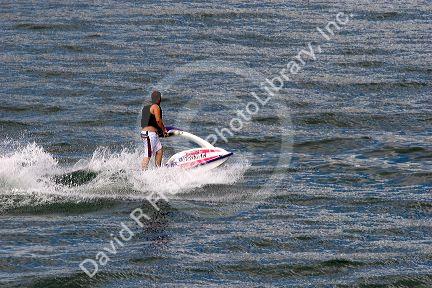 Recreationist rides a jet ski on Lucky Peak Reservior near Boise, Idaho.