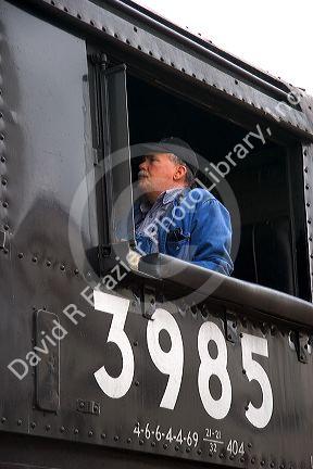 Engineer at the window of the historic Challenger locomotive steam engine.