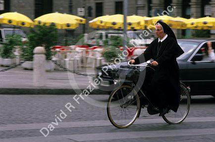 A nun riding a bicycle in Verona, Italy.