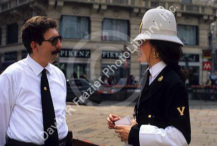 An Italian police woman speaks to a supervisor in Milan, Italy.