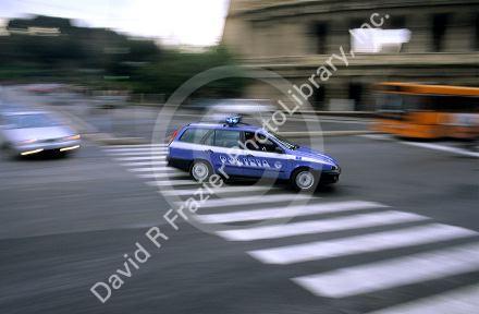 An Italian police car in motion. Rome, Italy.