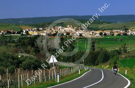 A rural highway and the village of Simala, Sardinia, Italy.