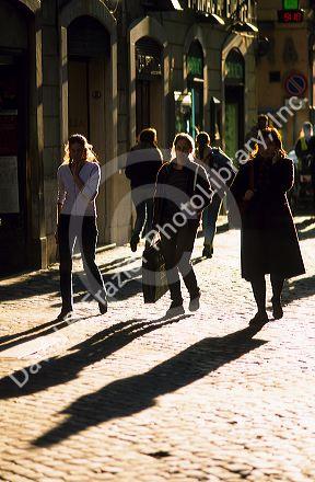 Pedestrians walking along the Via Della Croce in Rome, Italy.