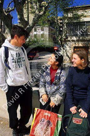 Teenage students talking in Majorca, Spain.
