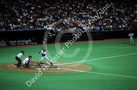 A professional baseball player up to bat at the Kansas City Royals baseball stadium.