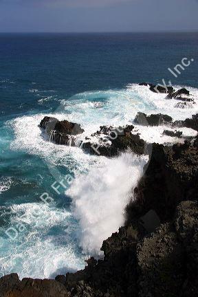 Waves crash in the pacific ocean off the island of Maui, Hawaii.