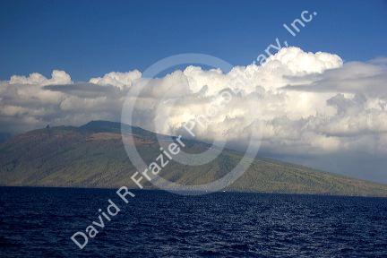 Clouds hang over the island of Maui, Hawaii.