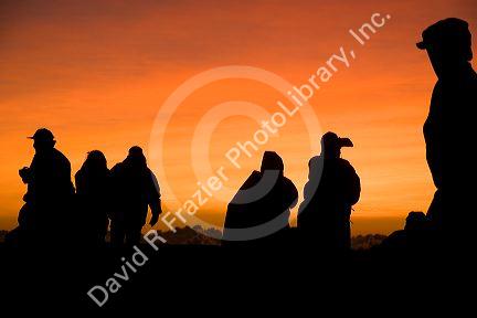 Tourists await the sunrise atop Haleakala Crater on the island of Maui, Hawaii.