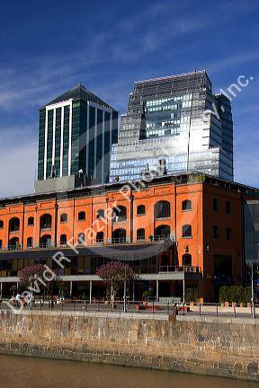 Modern office buildings and older red brick building at Puerto Modero in Buenos Aires, Argentina.