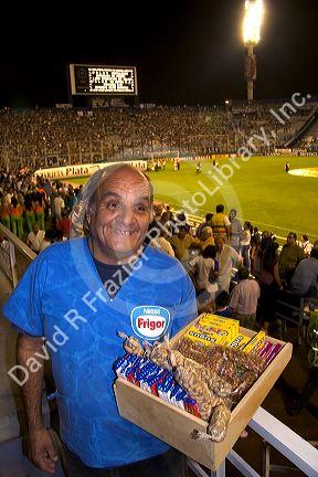 Vendor selling nuts and candy at a soccer game in the West Stadium in Buenos Aires, Argentina.