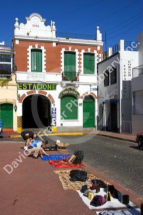 Vendors selling goods on the sidewalk in Buenos Aires, Argentina.