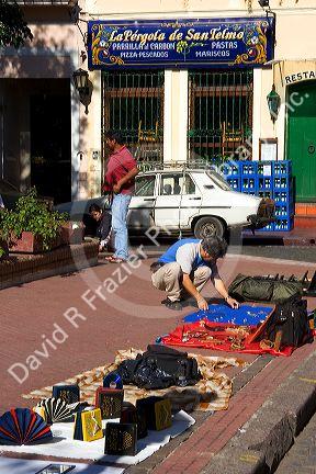 Vendors selling goods on the sidewalk in Buenos Aires, Argentina.