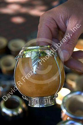 Street vendor selling carved gourds used to drink mate at Plaza Derrego in Buenos Aires, Argentina.