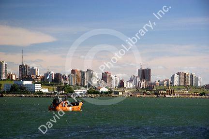 Fishing boat at Puerto Faro, Mar del Plata, Argentina heads out to sea.