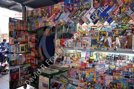 Vendor selling magazines and newspapers in Buenos Aires, Argentina.