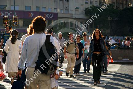 Pedestrians cross the street in Buenos Aires, Argentina.