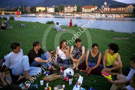 Germans having a picnic along the Neckar River in Heidelberg, Germany.