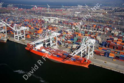 Container ships and cranes at the Port of Oakland, in the bay area of California.