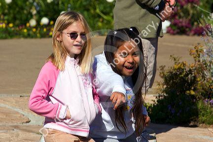 Mixed race young girls visit Balboa Park in San Diego, California.