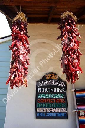 Dried chili peppers hang from a store front at Old Town, San Diego, California.