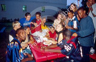 Muli-ethnic teens hanging out at the Texas State Fair.