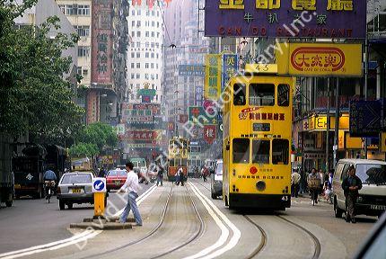 Street scene with trolleys in the city of Hong Kong.
