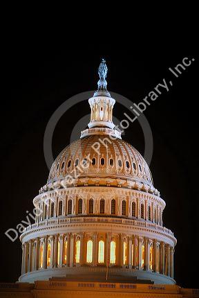 The dome atop the United States Capitol Building at night in Washington DC.