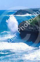 Waves crashing along the Kauai,  Hawaii coastline.