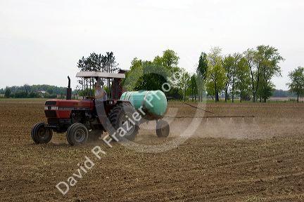 Northwest Ohio farmer spraying field with preemergant herbacide.