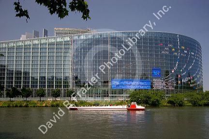 Tour boat on canal in front of the European Union Parliament in Strasbourg, France.