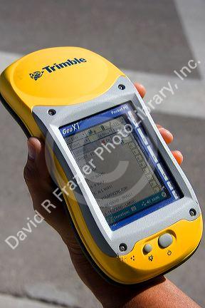 Person holding a handheld GIS device in the field, Boise, Idaho.
