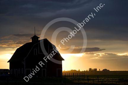 Barn near Burley, Idaho at sunset.