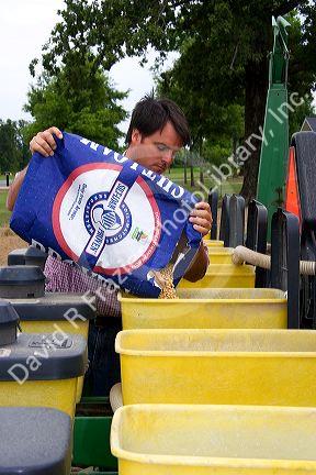 A farmer loading soy bean seeds into a planter in the east central delta region of Arkansas.