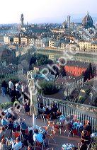 Outdoor cafe at Piazza Michelangelo overlooks Florence, Italy and the Arno River.