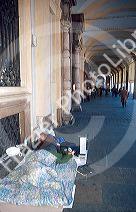 Homeless man sleeps on the street in Turin, Italy.