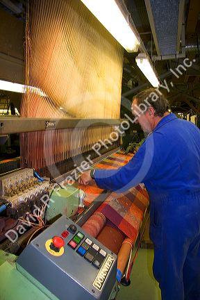 Textile loom in the Garnier-Thiebaut factory at Gerardmer, France.