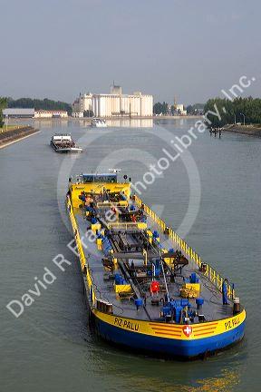 Barge on the Rhine River between France and Germany near Frieberg, Germany.