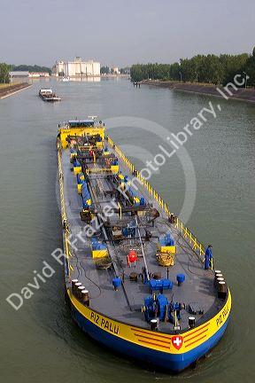 Barge on the Rhine River between France and Germany near Frieberg, Germany.