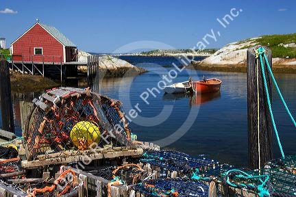 Lobster pots, buoys, and ropes on the dock at Peggy's Cove, Nova Scotia, Canada.