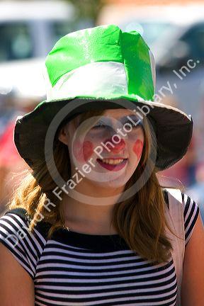 Girl dressed as a clown in a small town Fourth of July parade in Cascade, Idaho.
