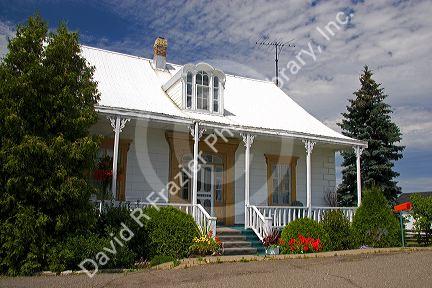 Cottage style homes in a rural area along the St. Lawrence River at L'lslet, Quebec, Canada.