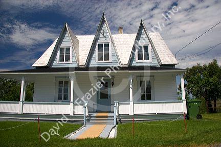 Cottage style homes in a rural area along the St. Lawrence River at L'lslet, Quebec, Canada.