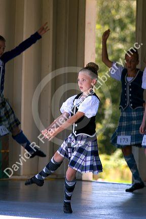 Young girl competes in a Scottish dance contest at Highland Festival on Prince Edward Island, Canada.