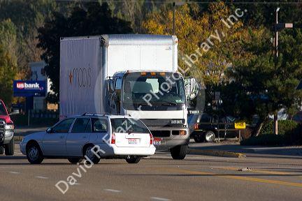Delivery truck in traffic turning left at an intersection in Boise, Idaho.